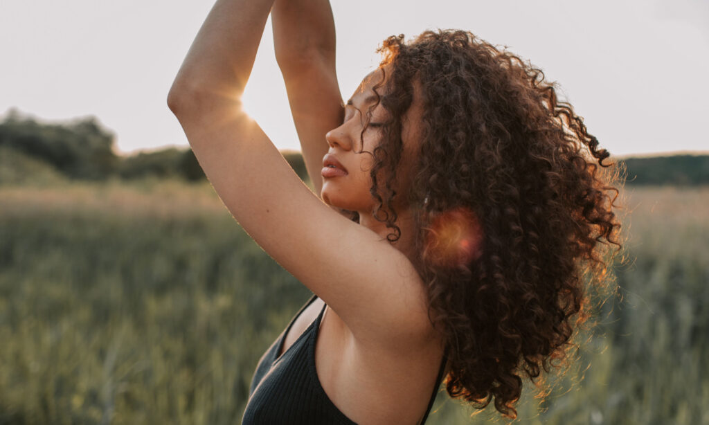 beautiful woman feeling connected to her body, her life, and her sexuality